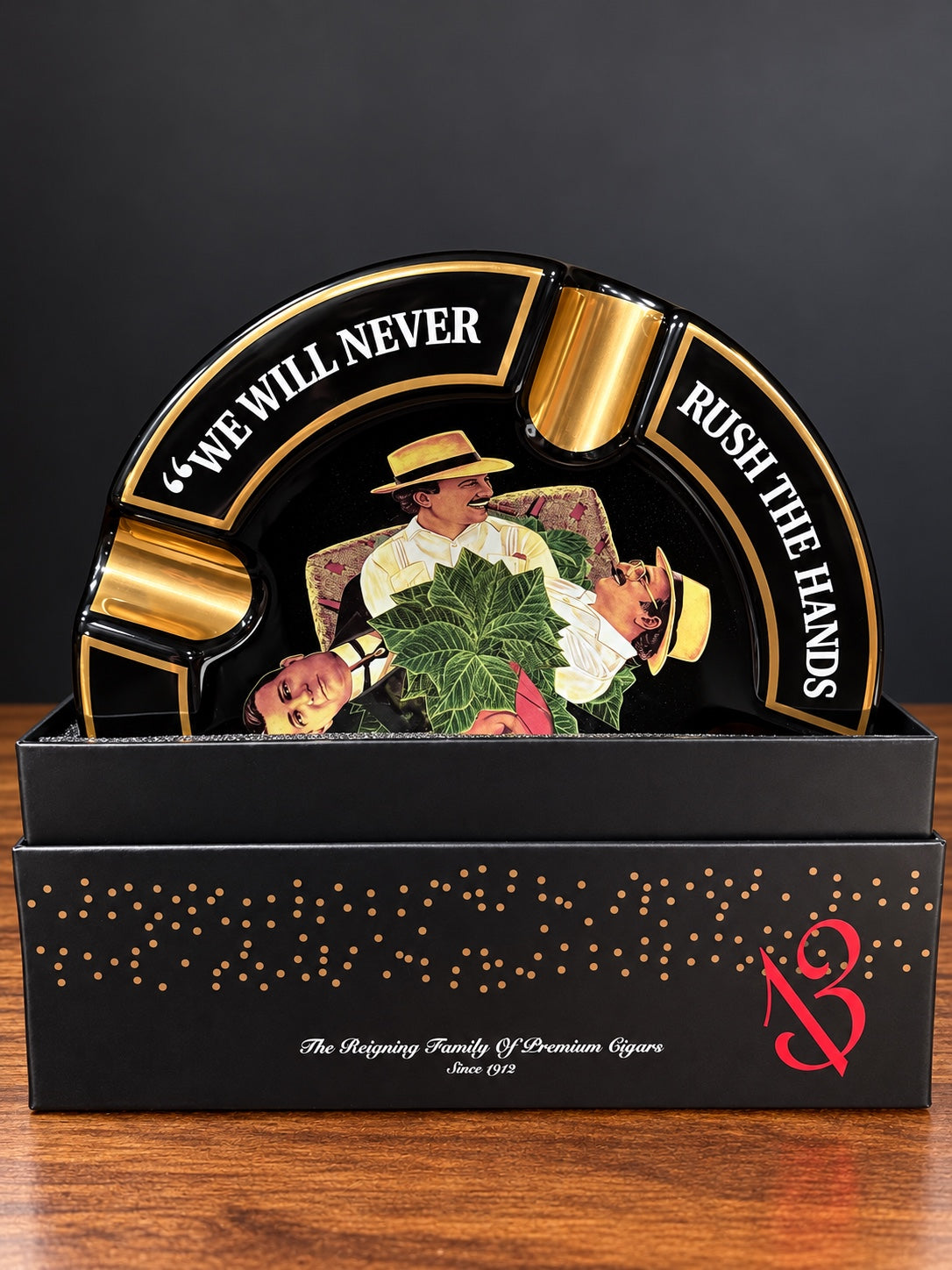 Arturo Fuente black and gold decorative ashtray with vintage-style illustrated centre and matching box