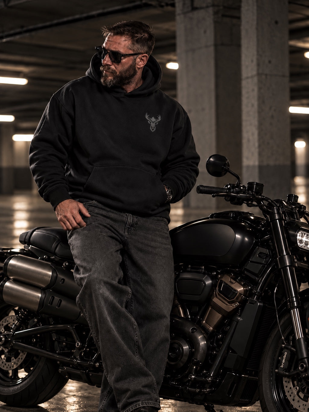North Stag black hoodie with stag chest emblem, motorcycle lifestyle campaign image