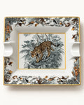 Top view of leopard jungle decorative ashtray with wildlife illustration and gold trim